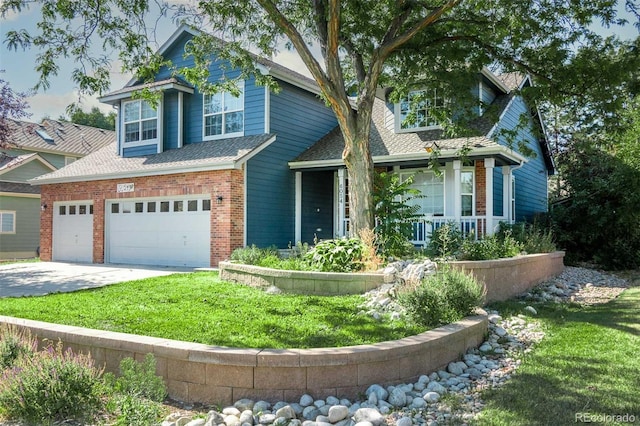 6054 W Adriatic Pl, Lakewood, CO 80227 - view of front of house with brick siding, concrete driveway, a porch, a front yard, and a garage