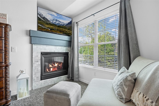5944 S Yank Ct, Littleton, CO 80127 - living area featuring carpet, a tile fireplace, healthy amount of natural light, and baseboards