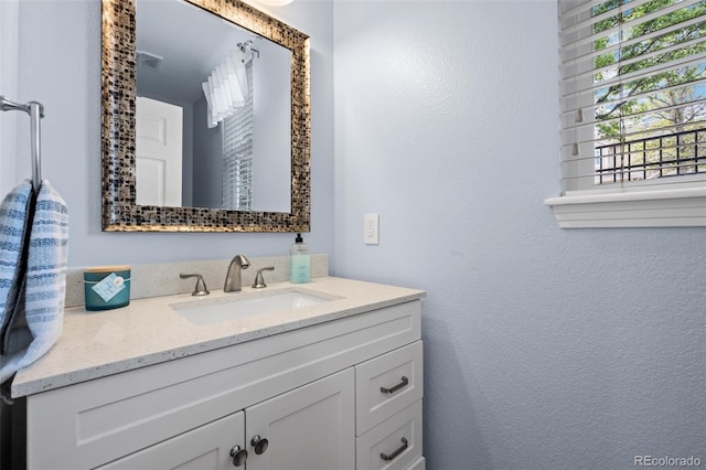 5944 S Yank Ct, Littleton, CO 80127 - bathroom with a textured wall and vanity
