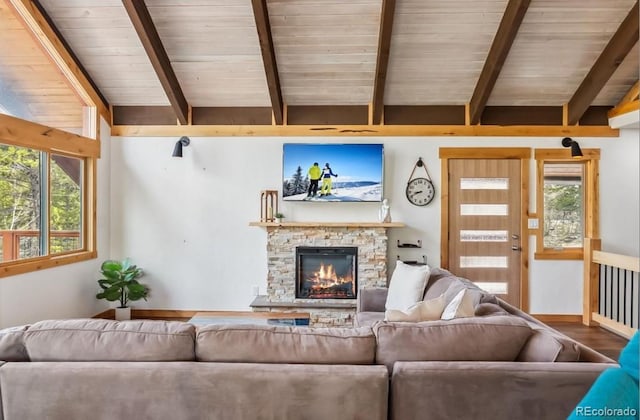 142 High Point Dr, Breckenridge, CO 80424 - living area with wood ceiling, a stone fireplace, and wood finished floors