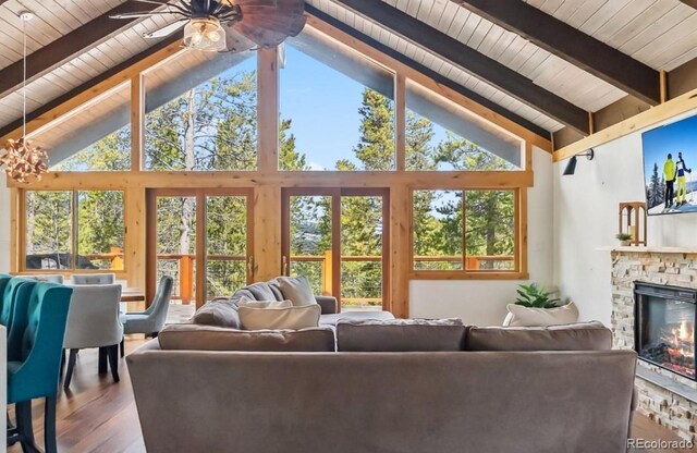142 High Point Dr, Breckenridge, CO 80424 - living room featuring high vaulted ceiling, beamed ceiling, wooden ceiling, plenty of natural light, and wood finished floors