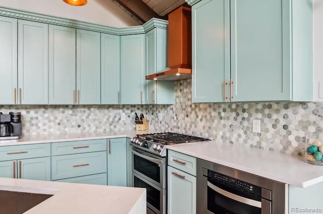 142 High Point Dr, Breckenridge, CO 80424 - kitchen featuring double oven range, wall chimney exhaust hood, light countertops, and decorative backsplash