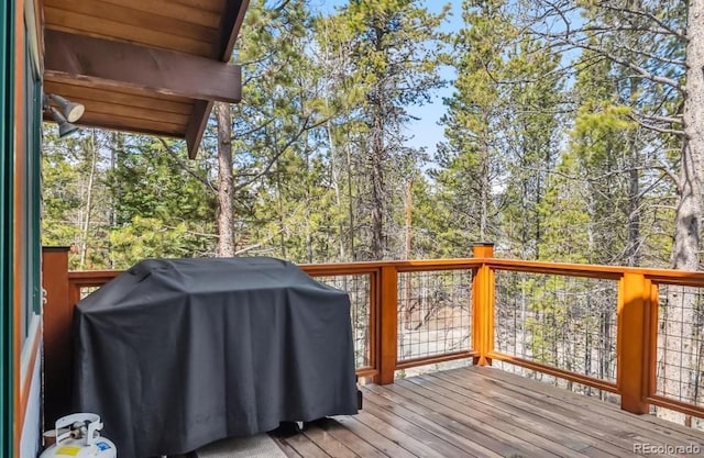142 High Point Dr, Breckenridge, CO 80424 - deck with area for grilling and view of wooded area