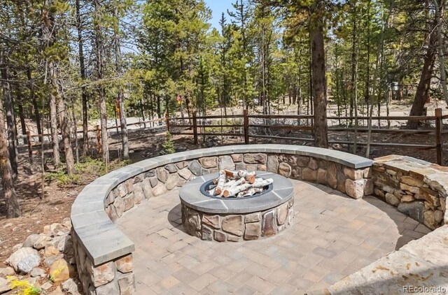 142 High Point Dr, Breckenridge, CO 80424 - view of patio featuring a fire pit and fence