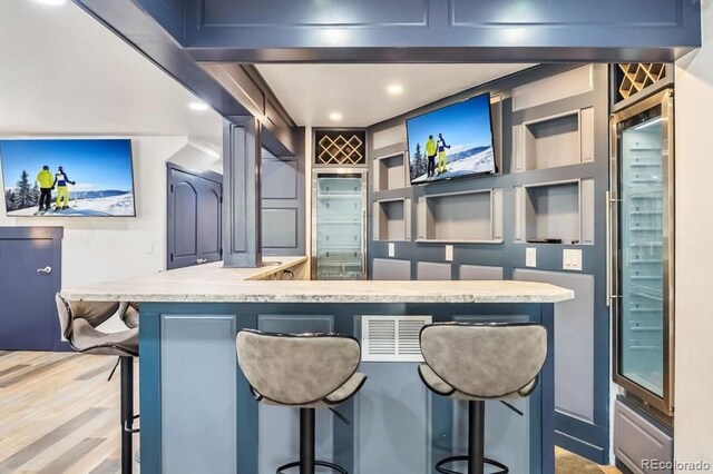 142 High Point Dr, Breckenridge, CO 80424 - bar featuring light wood-type flooring and recessed lighting