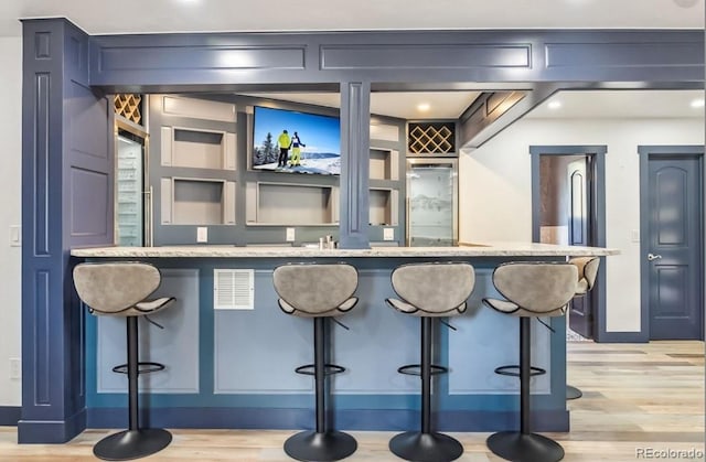 142 High Point Dr, Breckenridge, CO 80424 - indoor wet bar featuring light wood finished floors