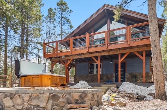 142 High Point Dr, Breckenridge, CO 80424 - rear view of house with a deck and stone siding