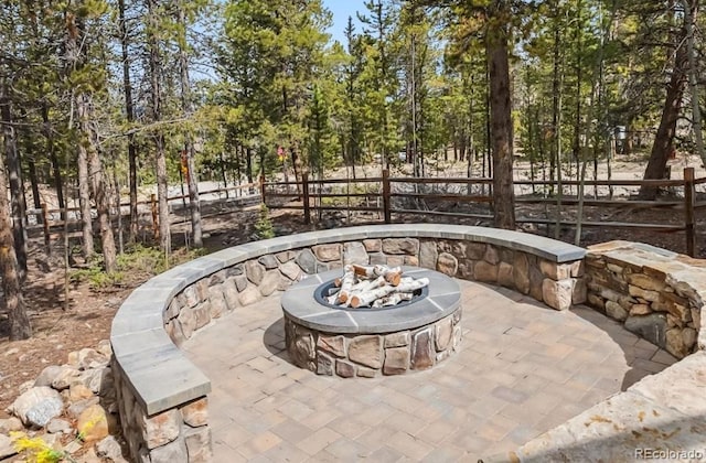 142 High Point Dr, Breckenridge, CO 80424 - view of patio with a fire pit, fence, and view of scattered trees