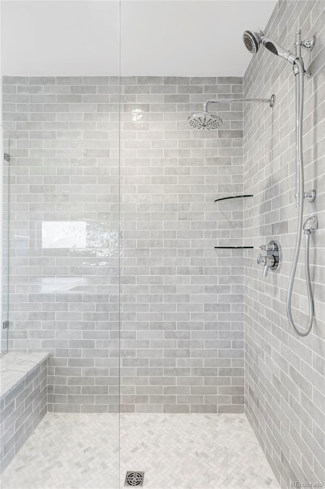 bathroom with tiled shower