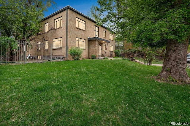 view of building exterior with a yard