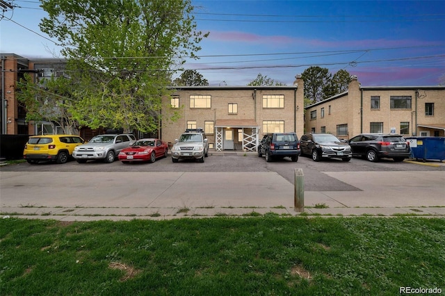 view of parking at dusk