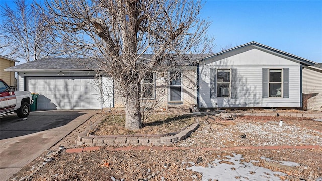 single story home with a garage