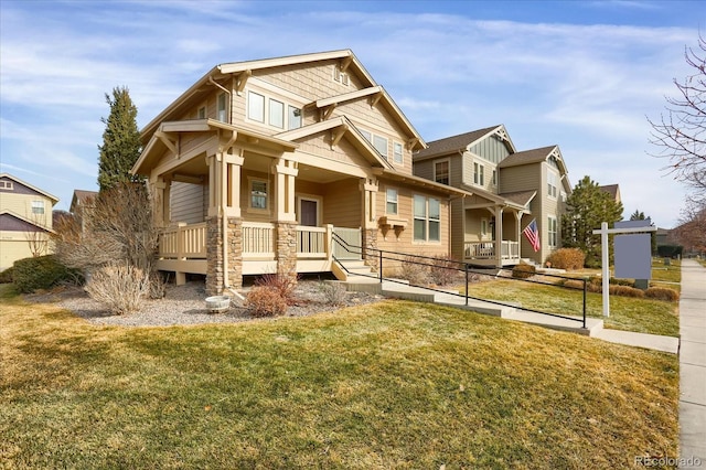 craftsman-style house with a porch and a front lawn