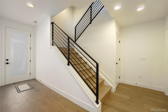 entryway with hardwood / wood-style flooring