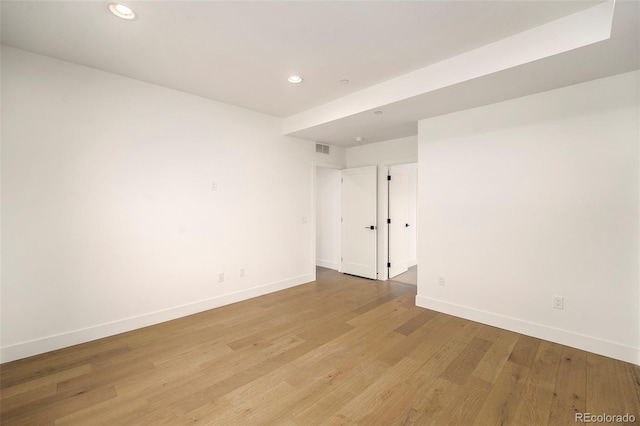 spare room with light hardwood / wood-style floors