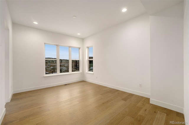 spare room with light hardwood / wood-style floors