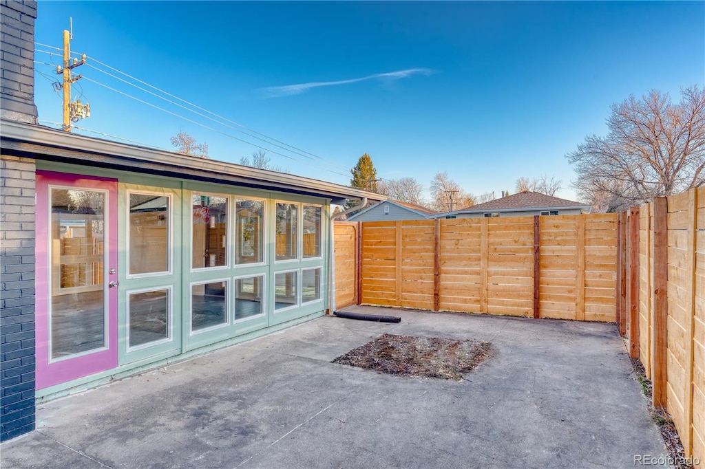 view of patio / terrace with a sunroom