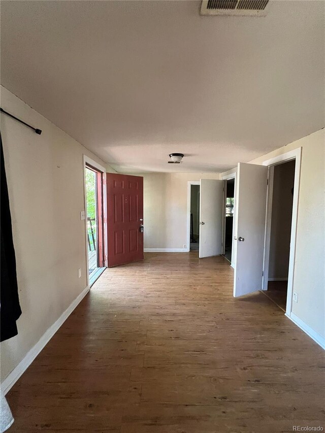 spare room featuring hardwood / wood-style floors