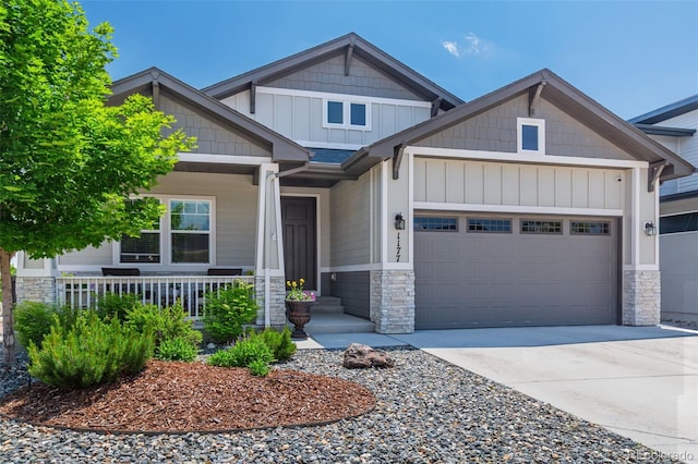 1177 Man O War Way, Colorado Springs, CO 80921 - craftsman inspired home with an attached garage, stone siding, driveway, and covered porch