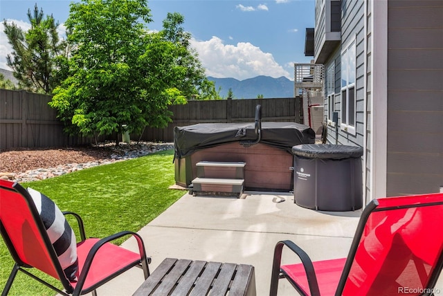 1177 Man O War Way, Colorado Springs, CO 80921 - fenced backyard with a hot tub, a patio area, and a mountain view