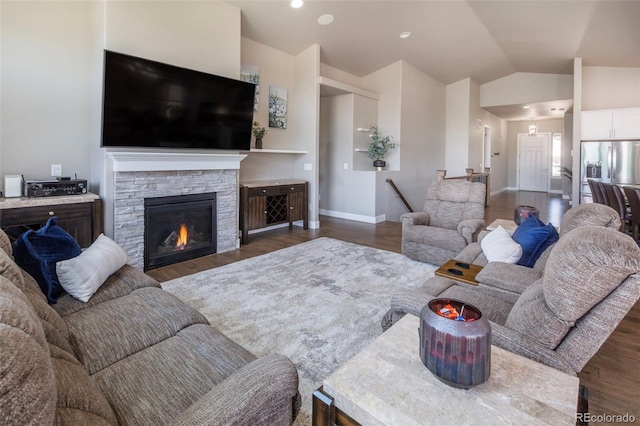 1177 Man O War Way, Colorado Springs, CO 80921 - living room with lofted ceiling, wood finished floors, and a fireplace