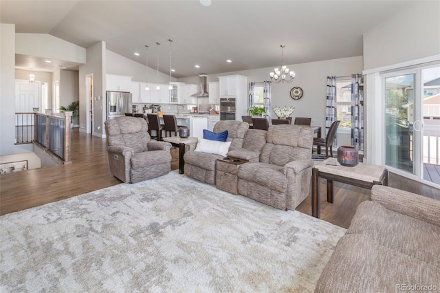 1177 Man O War Way, Colorado Springs, CO 80921 - living room with wood finished floors, a chandelier, lofted ceiling, and recessed lighting