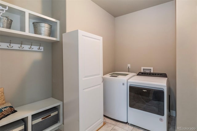 1177 Man O War Way, Colorado Springs, CO 80921 - laundry room featuring separate washer and dryer and light tile patterned flooring