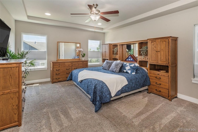 1177 Man O War Way, Colorado Springs, CO 80921 - bedroom with a tray ceiling, light carpet, recessed lighting, and a ceiling fan