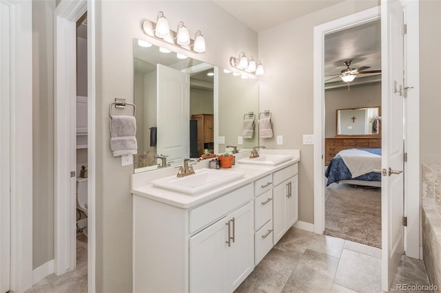1177 Man O War Way, Colorado Springs, CO 80921 - ensuite bathroom with double vanity and a ceiling fan