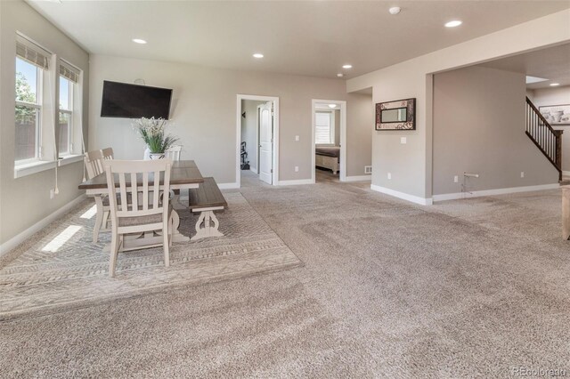 1177 Man O War Way, Colorado Springs, CO 80921 - dining space featuring light carpet, recessed lighting, and stairs