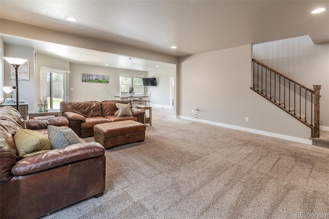 1177 Man O War Way, Colorado Springs, CO 80921 - carpeted living room featuring recessed lighting and stairway