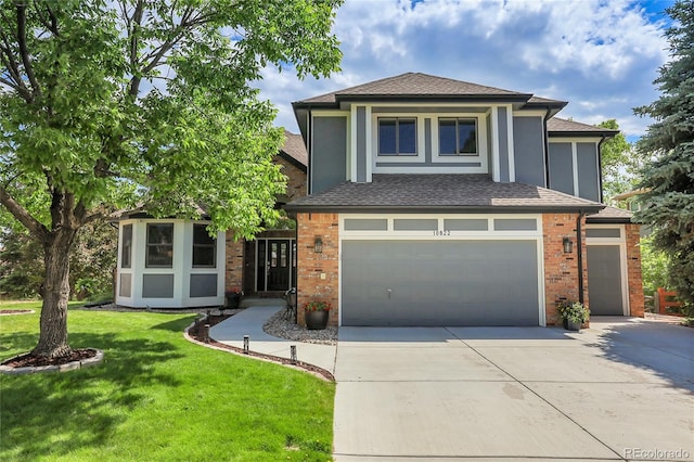10822 Eagle Crest Ct, Parker, CO 80138 - view of front facade with concrete driveway, a garage, a front lawn, roof with shingles, and brick siding