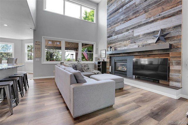 10822 Eagle Crest Ct, Parker, CO 80138 - living area with a towering ceiling, wood finished floors, a large fireplace, and recessed lighting