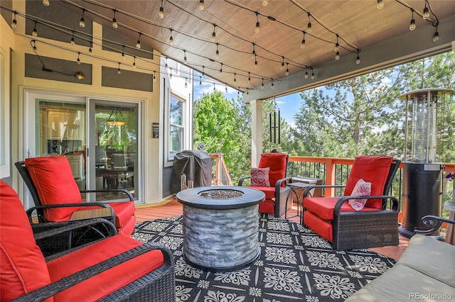 10822 Eagle Crest Ct, Parker, CO 80138 - view of patio with grilling area and an outdoor living space with a fire pit