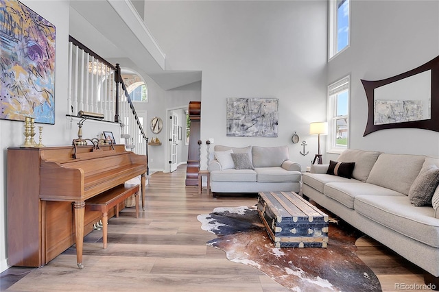 10822 Eagle Crest Ct, Parker, CO 80138 - living room featuring a towering ceiling, wood finished floors, and stairs