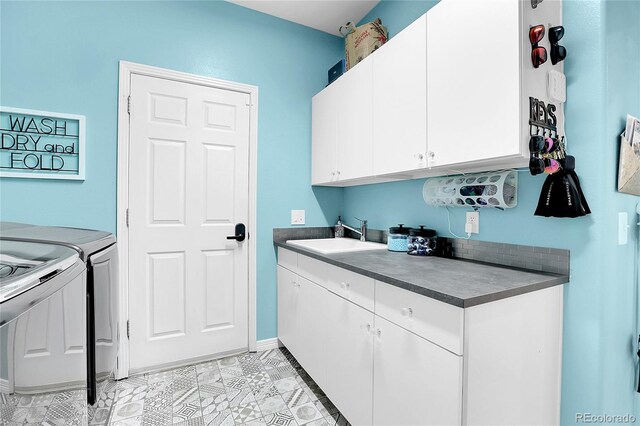 10822 Eagle Crest Ct, Parker, CO 80138 - laundry area featuring cabinet space and washer and clothes dryer
