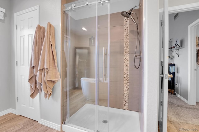 10822 Eagle Crest Ct, Parker, CO 80138 - full bath featuring a stall shower and wood finished floors