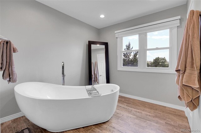 10822 Eagle Crest Ct, Parker, CO 80138 - full bathroom featuring a freestanding bath, wood finished floors, and recessed lighting