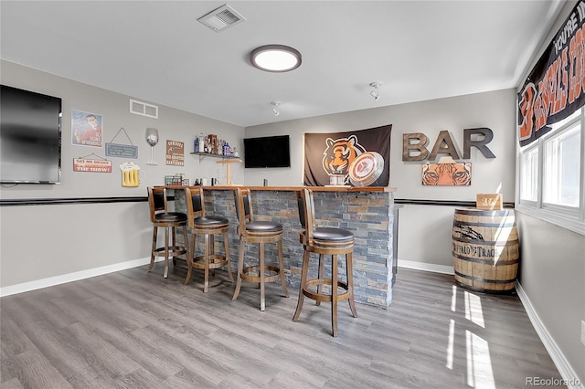 10822 Eagle Crest Ct, Parker, CO 80138 - indoor wet bar featuring wood finished floors and baseboards
