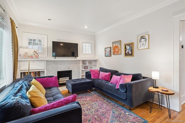 1870 S Ogden St, Denver, CO 80210 - living room featuring wood finished floors, ornamental molding, a fireplace, recessed lighting, and baseboards