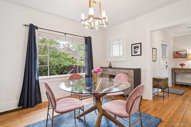 1870 S Ogden St, Denver, CO 80210 - dining area with a chandelier and light wood-style flooring