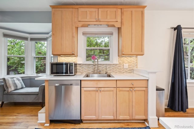 1870 S Ogden St, Denver, CO 80210 - kitchen featuring stainless steel appliances, a sink, and light brown cabinetry