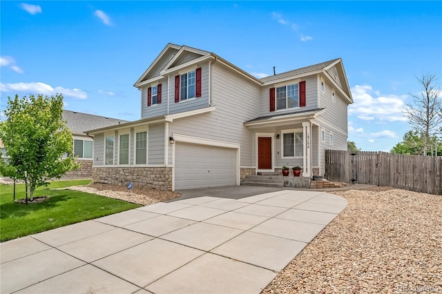 13152 E 104th Dr, Commerce City, CO 80022 - traditional home with an attached garage, stone siding, and driveway