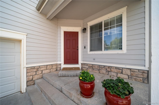 13152 E 104th Dr, Commerce City, CO 80022 - doorway to property with a porch and stone siding