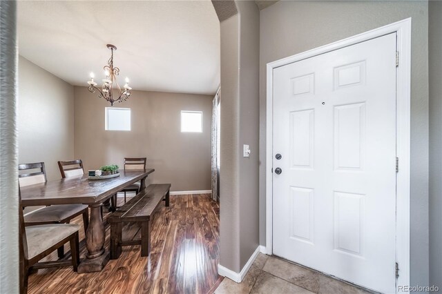 13152 E 104th Dr, Commerce City, CO 80022 - dining area featuring a chandelier and wood finished floors