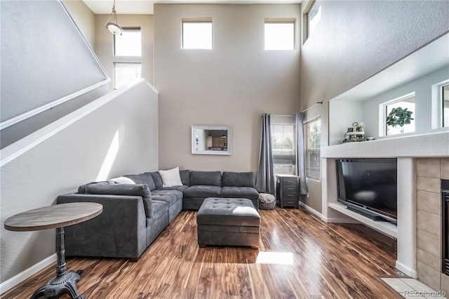 13152 E 104th Dr, Commerce City, CO 80022 - living area with a high ceiling and wood finished floors