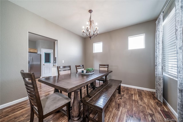 13152 E 104th Dr, Commerce City, CO 80022 - dining room featuring a chandelier and wood finished floors