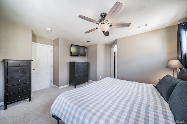 13152 E 104th Dr, Commerce City, CO 80022 - bedroom featuring light colored carpet, arched walkways, and a ceiling fan