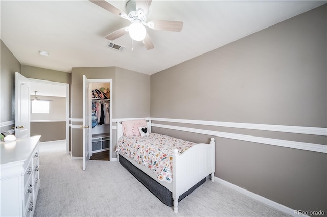 13152 E 104th Dr, Commerce City, CO 80022 - bedroom with light carpet, ceiling fan, a closet, and a walk in closet