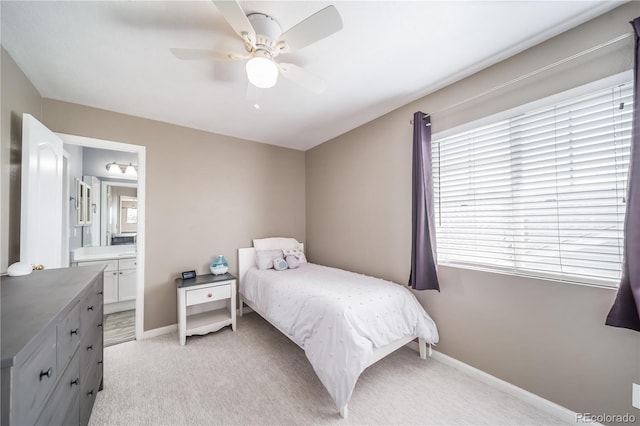 13152 E 104th Dr, Commerce City, CO 80022 - bedroom with light carpet, ensuite bathroom, and ceiling fan